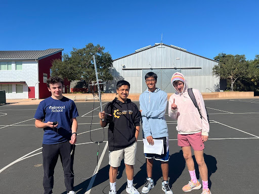 Oakwood students standing with antenna